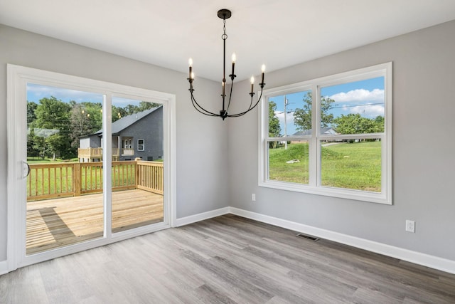 578 Oak Glen Dr, Smithville, TN 37166 - unfurnished dining area featuring a chandelier and wood finished floors