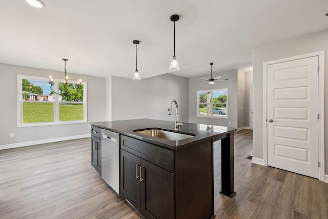 578 Oak Glen Dr, Smithville, TN 37166 - kitchen with dishwasher, wood finished floors, dark stone counters, and decorative light fixtures