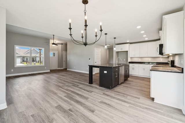 578 Oak Glen Dr, Smithville, TN 37166 - kitchen featuring dark countertops, stove, light wood finished floors, a ceiling fan, and recessed lighting
