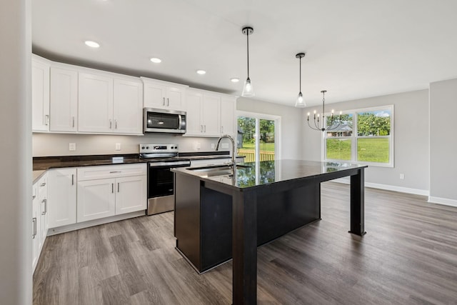 578 Oak Glen Dr, Smithville, TN 37166 - kitchen with stainless steel appliances, dark countertops, healthy amount of natural light, and recessed lighting