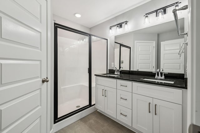 578 Oak Glen Dr, Smithville, TN 37166 - bathroom with a shower stall, double vanity, and tile patterned flooring