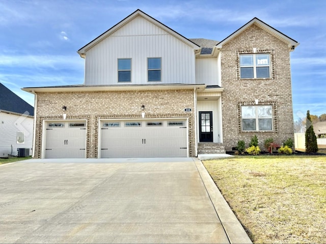220 Young Ln, Pleasant View, TN 37146 - view of front facade featuring brick siding, concrete driveway, board and batten siding, and an attached garage