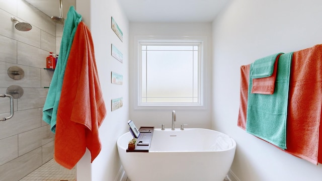 220 Young Ln, Pleasant View, TN 37146 - bathroom featuring healthy amount of natural light, a freestanding bath, and a tile shower