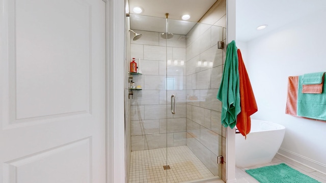 220 Young Ln, Pleasant View, TN 37146 - bathroom with a shower stall, a freestanding bath, tile patterned floors, and recessed lighting