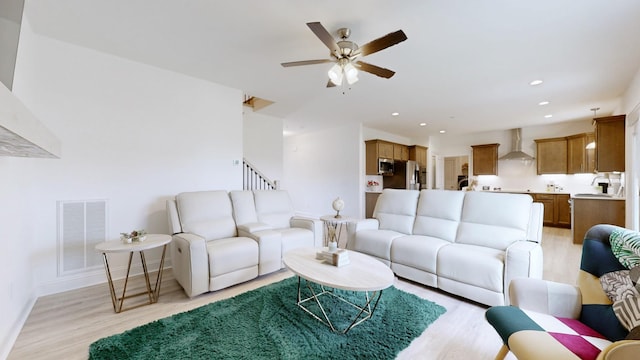 220 Young Ln, Pleasant View, TN 37146 - living area featuring light wood-style floors, a ceiling fan, stairs, and recessed lighting
