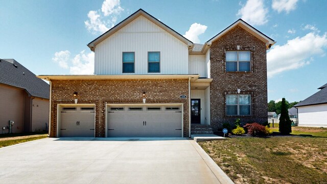 220 Young Ln, Pleasant View, TN 37146 - traditional-style home featuring brick siding, concrete driveway, a garage, and a front yard
