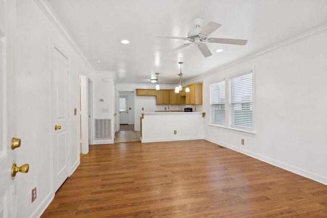 354 9th Ave N, Franklin, TN 37064 - unfurnished living room featuring ornamental molding, ceiling fan, light wood-style flooring, and recessed lighting