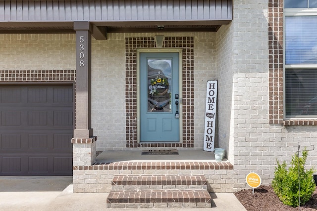 5308 Abbottswood Dr, Smyrna, TN 37167 - view of exterior entry featuring brick siding and an attached garage