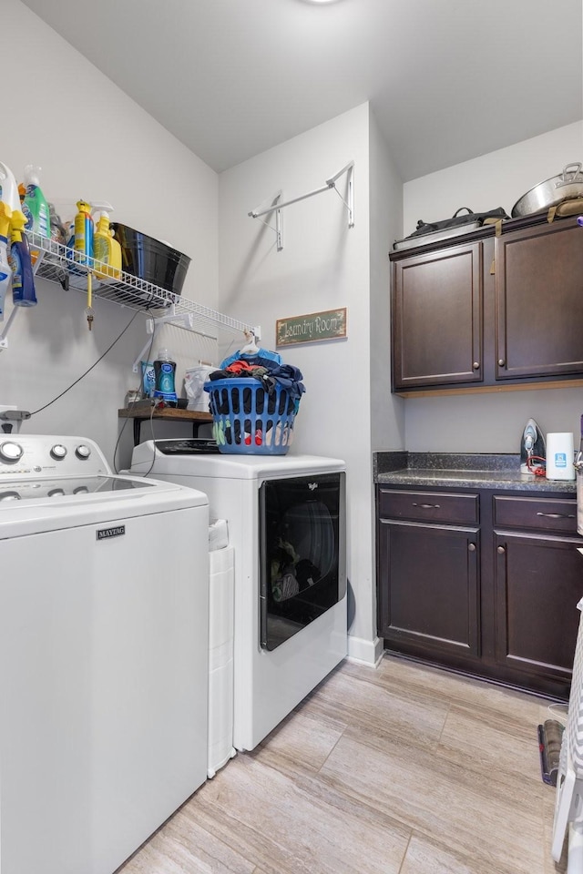 5308 Abbottswood Dr, Smyrna, TN 37167 - laundry room featuring washer and clothes dryer, cabinet space, and light wood-style floors