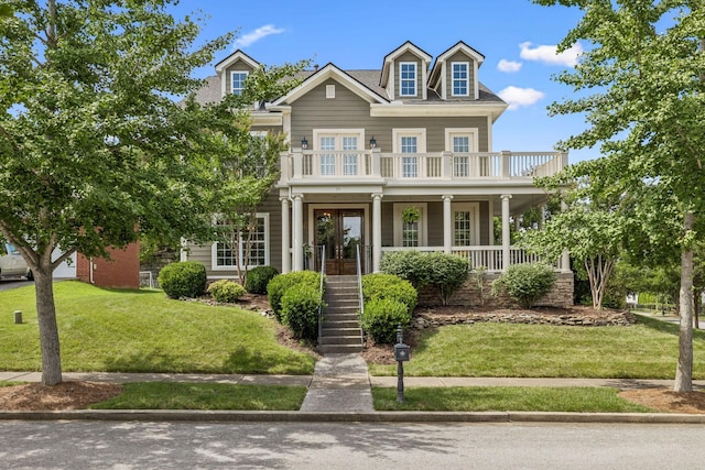 311 Wandering Cir, Franklin, TN 37067 - view of front of home with a porch, a front lawn, a balcony, and stairway