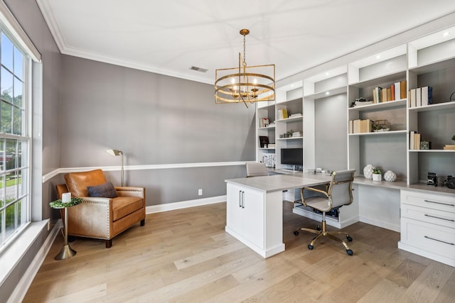 311 Wandering Cir, Franklin, TN 37067 - office space with built in desk, light wood-type flooring, crown molding, and a chandelier