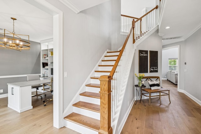 311 Wandering Cir, Franklin, TN 37067 - stairs featuring wood finished floors, a chandelier, ornamental molding, and recessed lighting