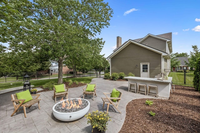 311 Wandering Cir, Franklin, TN 37067 - fenced backyard featuring a fire pit and a patio