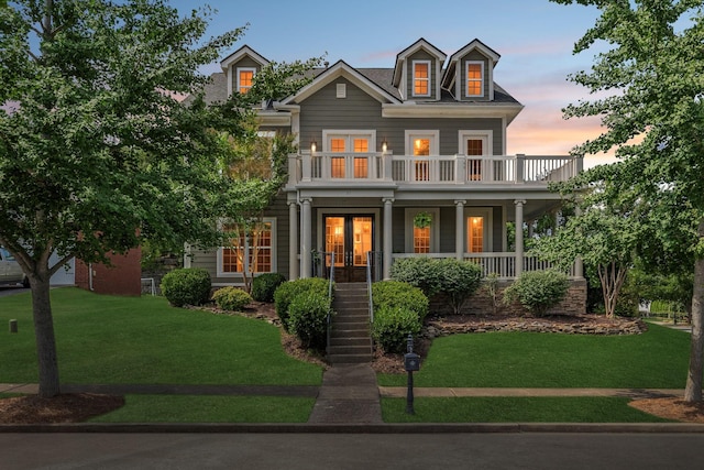 311 Wandering Cir, Franklin, TN 37067 - view of front of property featuring french doors, a porch, a lawn, and stairs