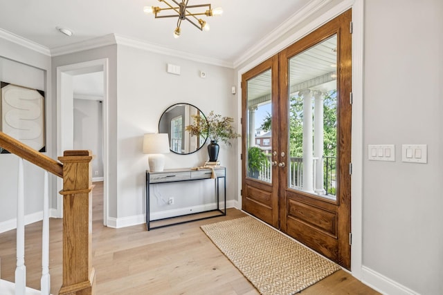 311 Wandering Cir, Franklin, TN 37067 - foyer entrance with a chandelier, light wood finished floors, stairway, and crown molding