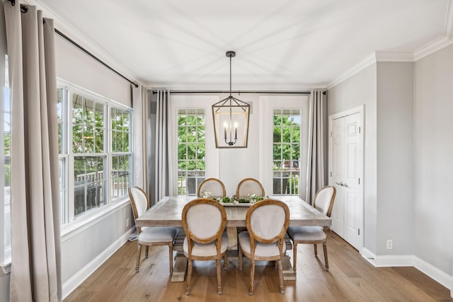 311 Wandering Cir, Franklin, TN 37067 - dining space featuring crown molding, a chandelier, and light wood-style floors