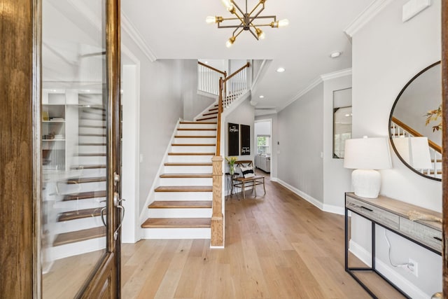 311 Wandering Cir, Franklin, TN 37067 - stairway featuring ornamental molding, wood finished floors, recessed lighting, and a chandelier