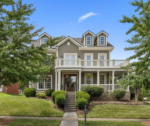 311 Wandering Cir, Franklin, TN 37067 - view of front facade with a porch, a front lawn, and french doors