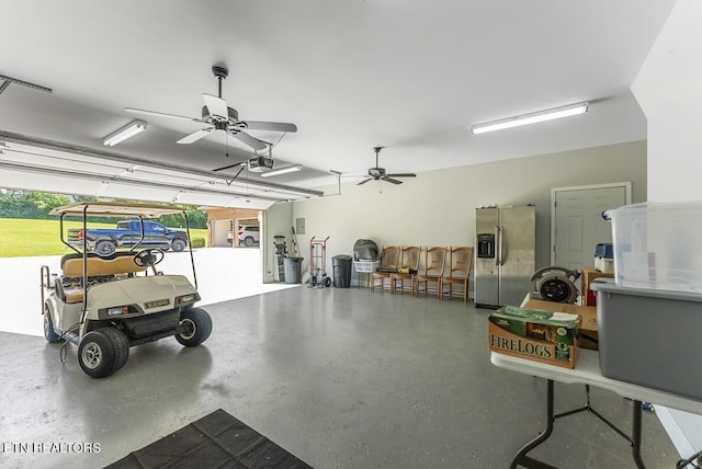 2091 Wesley Chapel Rd, Pikeville, TN 37367 - garage featuring stainless steel fridge with ice dispenser, a garage door opener, and a ceiling fan