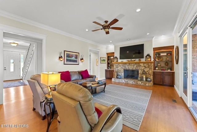 2091 Wesley Chapel Rd, Pikeville, TN 37367 - living room with a ceiling fan, wood finished floors, a fireplace, recessed lighting, and crown molding
