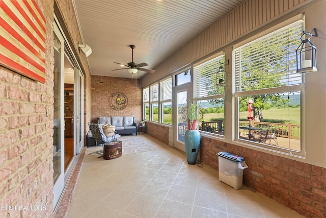 2091 Wesley Chapel Rd, Pikeville, TN 37367 - sunroom / solarium with brick wall, ceiling fan, and tile patterned floors