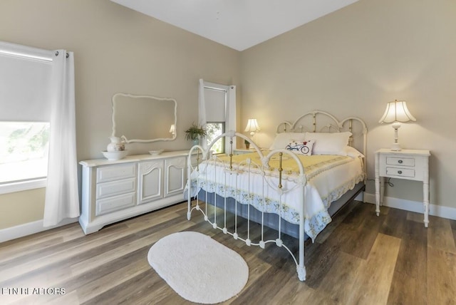 2091 Wesley Chapel Rd, Pikeville, TN 37367 - bedroom featuring multiple windows and wood finished floors