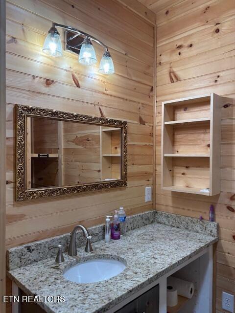 337 Bellview Rd, Pikeville, TN 37367 - bathroom featuring wood walls and vanity