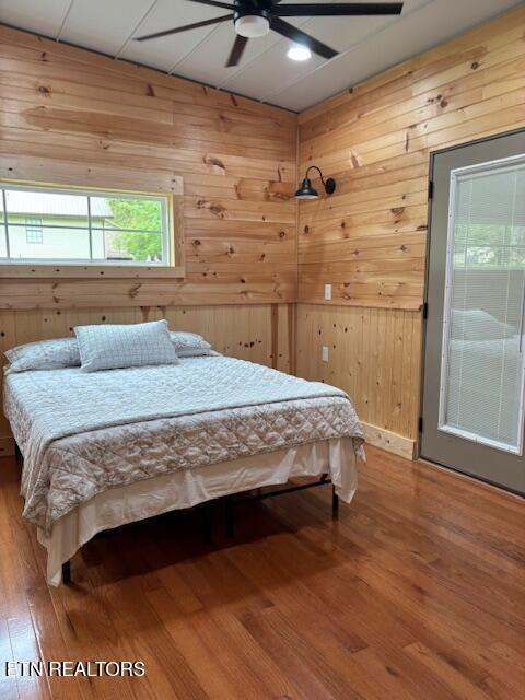337 Bellview Rd, Pikeville, TN 37367 - bedroom featuring wooden walls, wood finished floors, vaulted ceiling, and ceiling fan