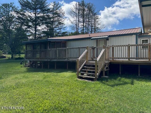 337 Bellview Rd, Pikeville, TN 37367 - back of house with a deck, a lawn, and a metal roof