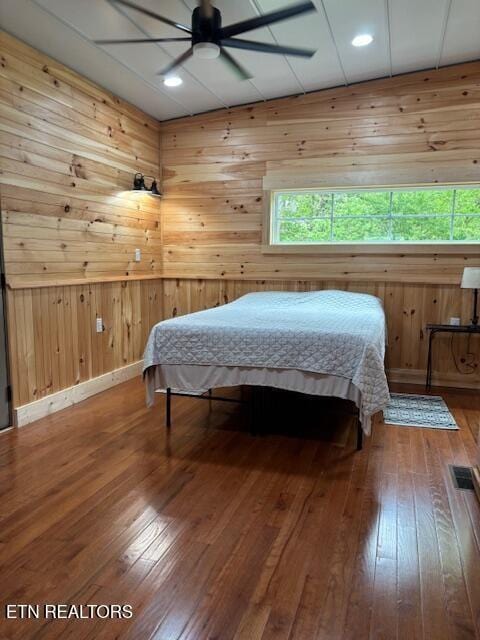 337 Bellview Rd, Pikeville, TN 37367 - bedroom with hardwood / wood-style floors, wooden walls, multiple windows, and recessed lighting