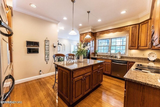 233 Nine Mile Cross Rd, Pikeville, TN 37367 - kitchen with dishwasher, a kitchen bar, light wood-style floors, ornamental molding, and dark stone counters