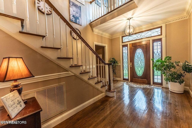 233 Nine Mile Cross Rd, Pikeville, TN 37367 - foyer with a high ceiling, wood finished floors, stairs, crown molding, and a chandelier