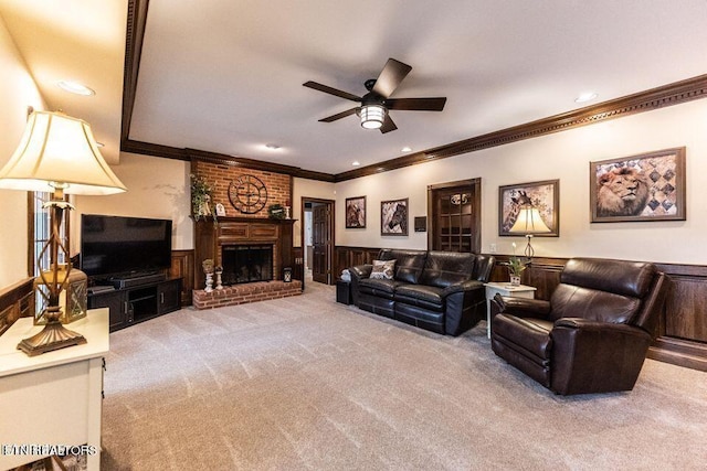 233 Nine Mile Cross Rd, Pikeville, TN 37367 - living room with ornamental molding, carpet floors, ceiling fan, wainscoting, and a brick fireplace