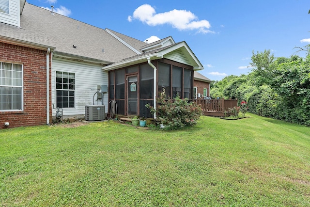 245 Northcrest Commons Cir, Nashville, TN 37211 - rear view of house featuring a sunroom, a lawn, brick siding, and a shingled roof