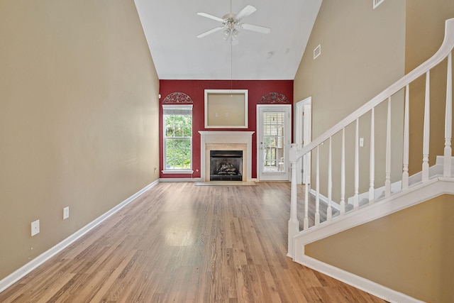 245 Northcrest Commons Cir, Nashville, TN 37211 - unfurnished living room featuring high vaulted ceiling, stairs, a ceiling fan, wood finished floors, and a fireplace