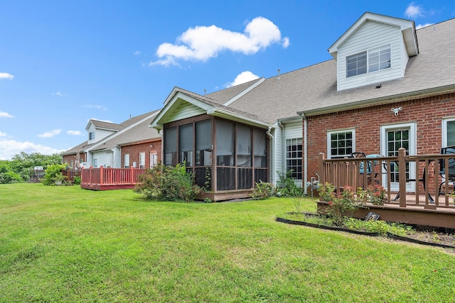 245 Northcrest Commons Cir, Nashville, TN 37211 - back of property with brick siding, a sunroom, a deck, and a yard