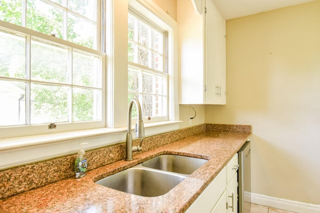 1204 Rolling Fields Dr, Columbia, TN 38401 - kitchen featuring healthy amount of natural light, white cabinets, and light stone countertops