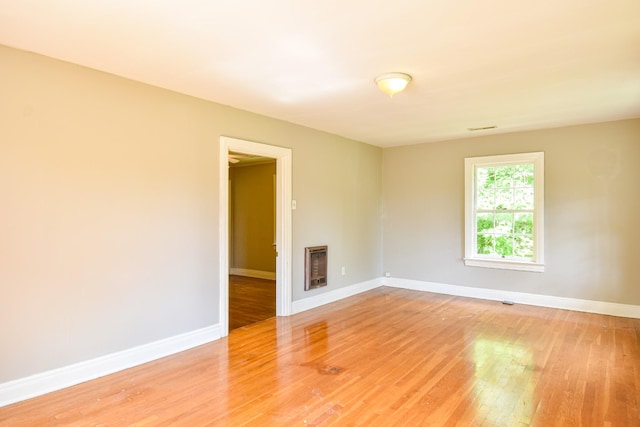 1204 Rolling Fields Dr, Columbia, TN 38401 - unfurnished room with light wood-type flooring, heating unit, and a fireplace