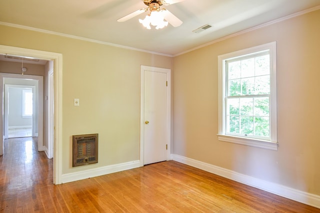 1204 Rolling Fields Dr, Columbia, TN 38401 - empty room featuring heating unit, light wood-style floors, ceiling fan, crown molding, and attic access