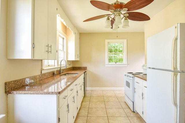 1204 Rolling Fields Dr, Columbia, TN 38401 - kitchen with white appliances, ceiling fan, white cabinets, light stone countertops, and light tile patterned floors