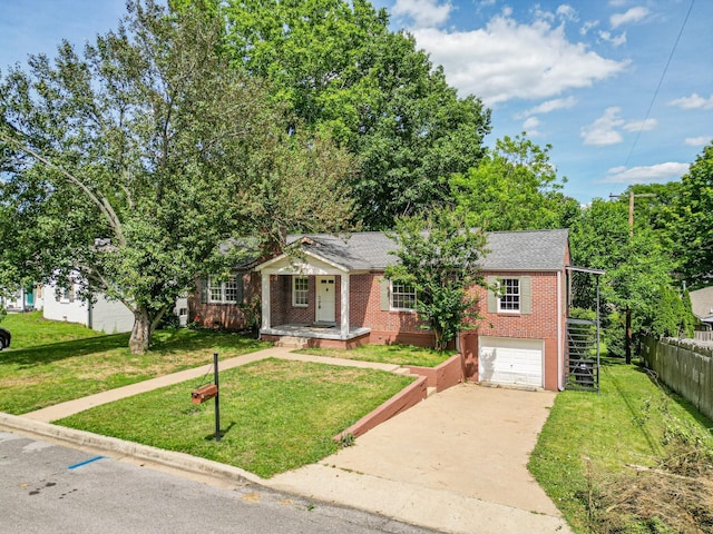 1204 Rolling Fields Dr, Columbia, TN 38401 - view of front facade with driveway, brick siding, and an attached garage