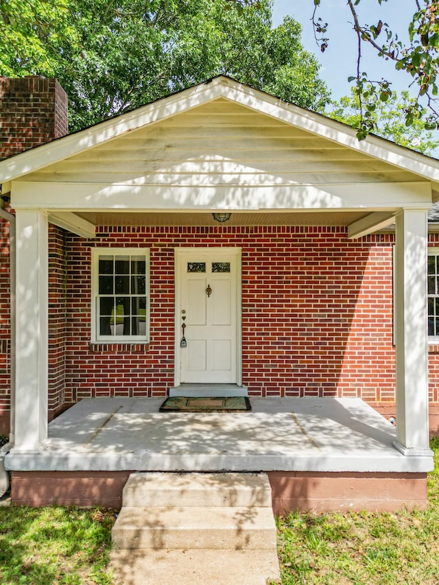 1204 Rolling Fields Dr, Columbia, TN 38401 - doorway to property featuring brick siding and a chimney