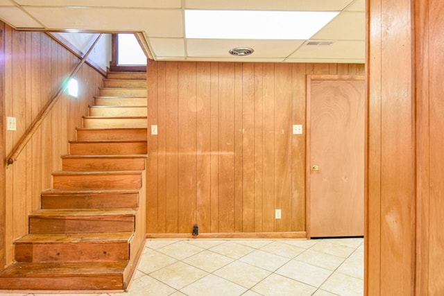 1204 Rolling Fields Dr, Columbia, TN 38401 - staircase featuring wooden walls, tile patterned flooring, and a drop ceiling