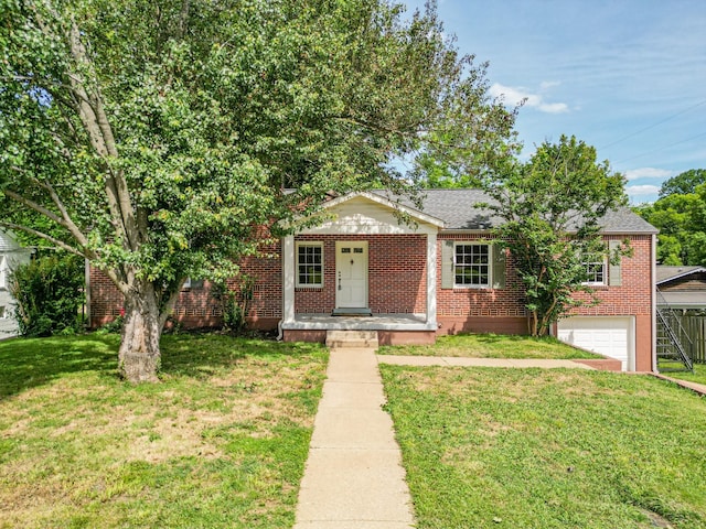 1204 Rolling Fields Dr, Columbia, TN 38401 - view of front facade featuring brick siding, a garage, and a front lawn