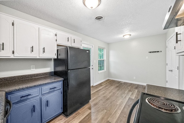 408 Eddy St, Oak Grove, KY 42262 - kitchen featuring black appliances, dark countertops, light wood-type flooring, a textured ceiling, and white cabinetry