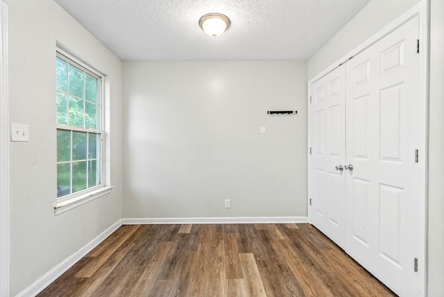 408 Eddy St, Oak Grove, KY 42262 - unfurnished room featuring plenty of natural light, wood finished floors, and a textured ceiling