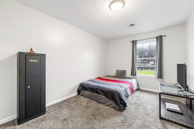 408 Eddy St, Oak Grove, KY 42262 - carpeted bedroom with baseboards and a textured ceiling
