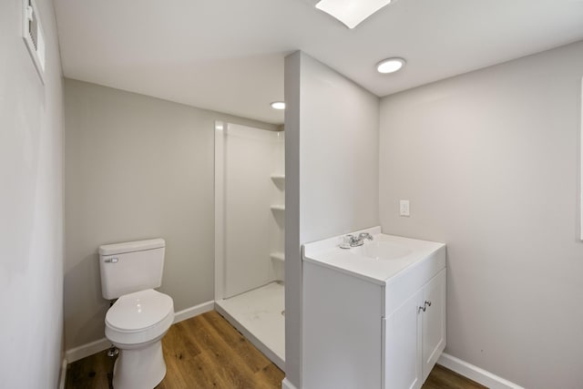 102 Hodges St N, Cowan, TN 37318 - full bath with wood finished floors, a stall shower, and vanity