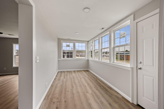 102 Hodges St N, Cowan, TN 37318 - unfurnished sunroom featuring wood finished floors and baseboards