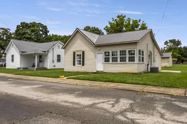 102 Hodges St N, Cowan, TN 37318 - view of front of property with a front yard and a metal roof